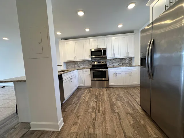 Granite countertops, stainless steel appliances, soft close cabinets