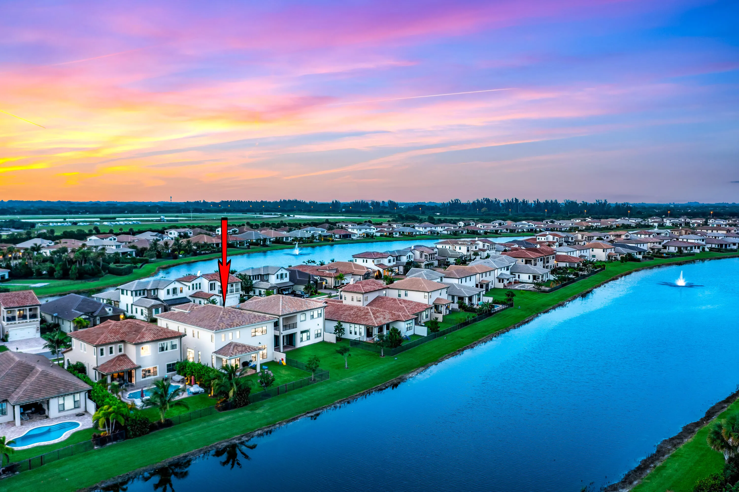 Waterside property with a private pool, covered patio, and terracotta roof tiles
