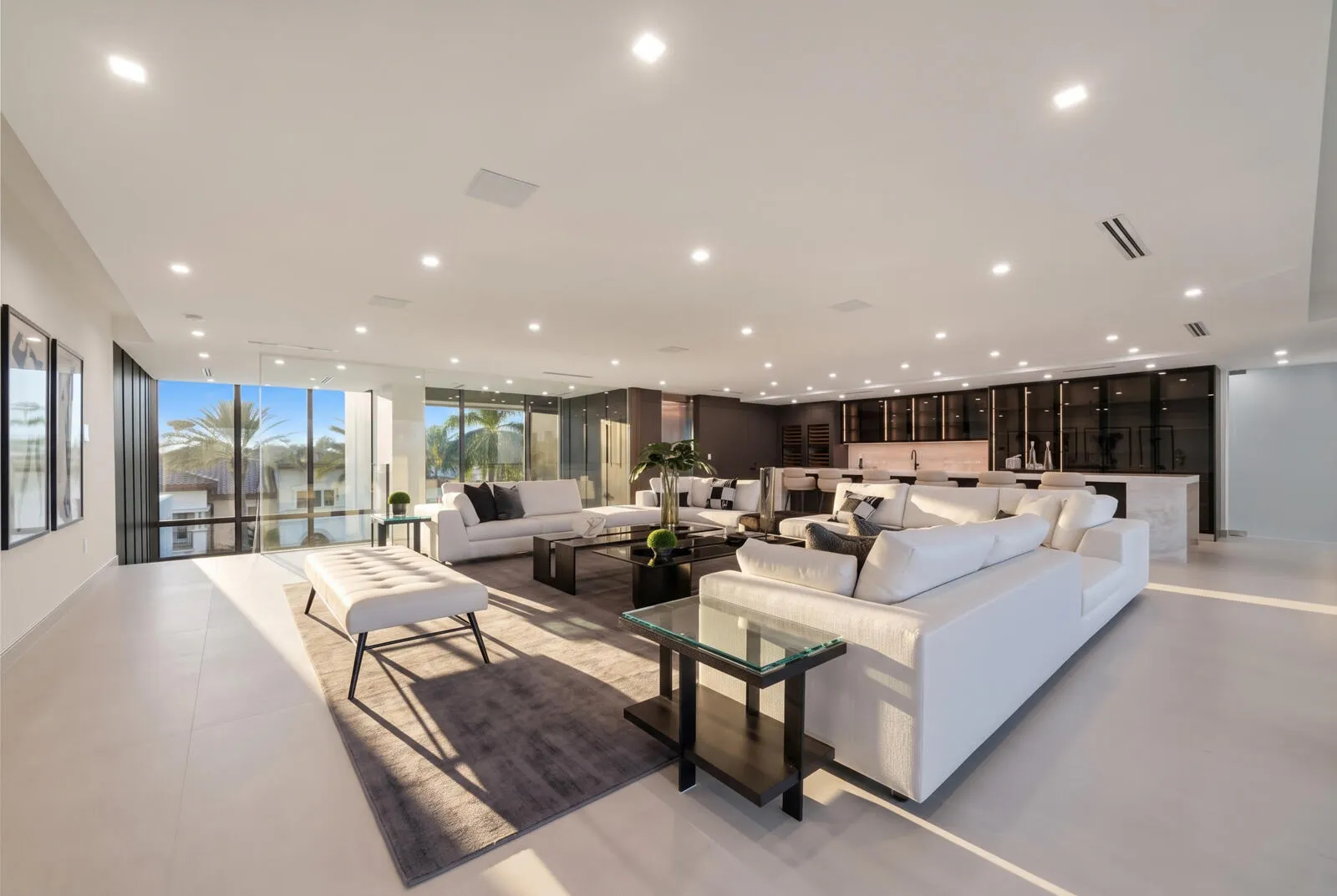 Entire third level conceived as a private entertainment destination, combining an expansive sky lounge, illuminated onyx bar, dual wine storage, and abundant natural light.