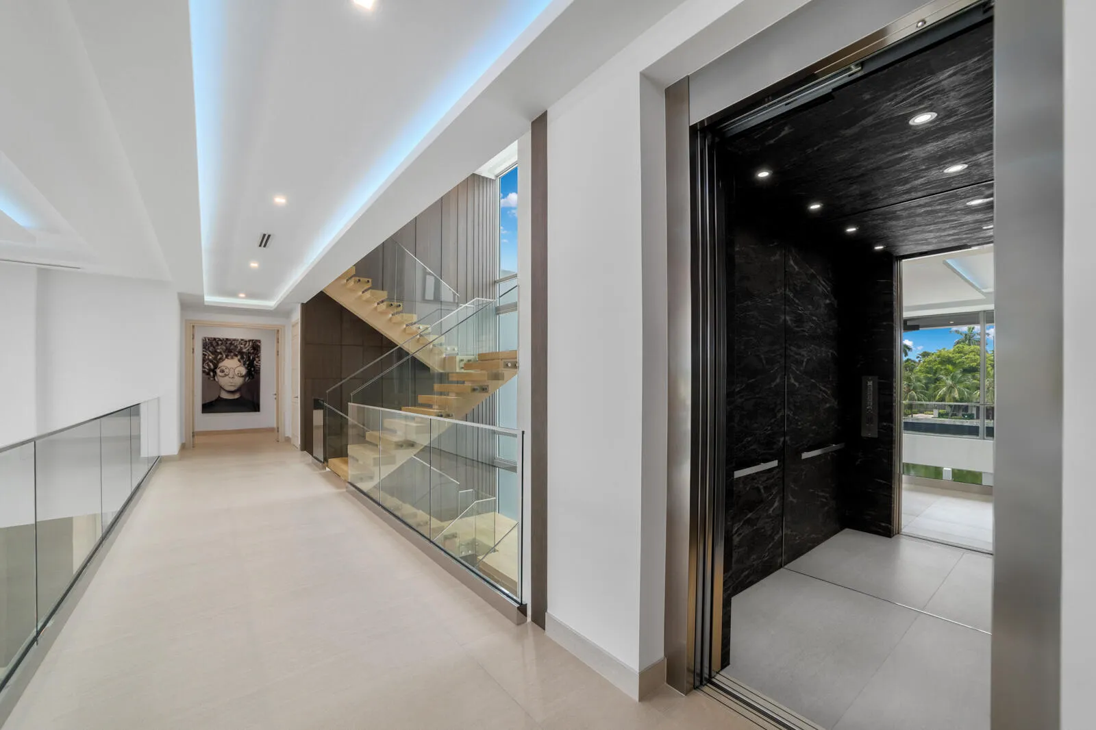 Private elevator with a dramatic black marble interior provides effortless access to every level of the residence.