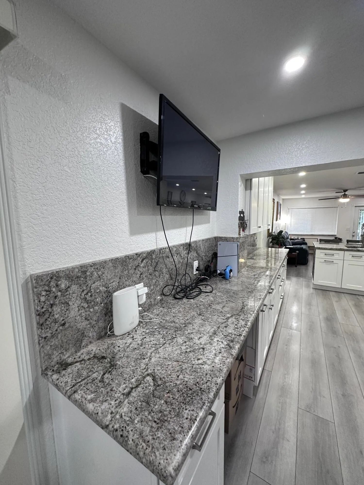 Office Desk Cutout at workspace, TV Wall Mounted for more space.