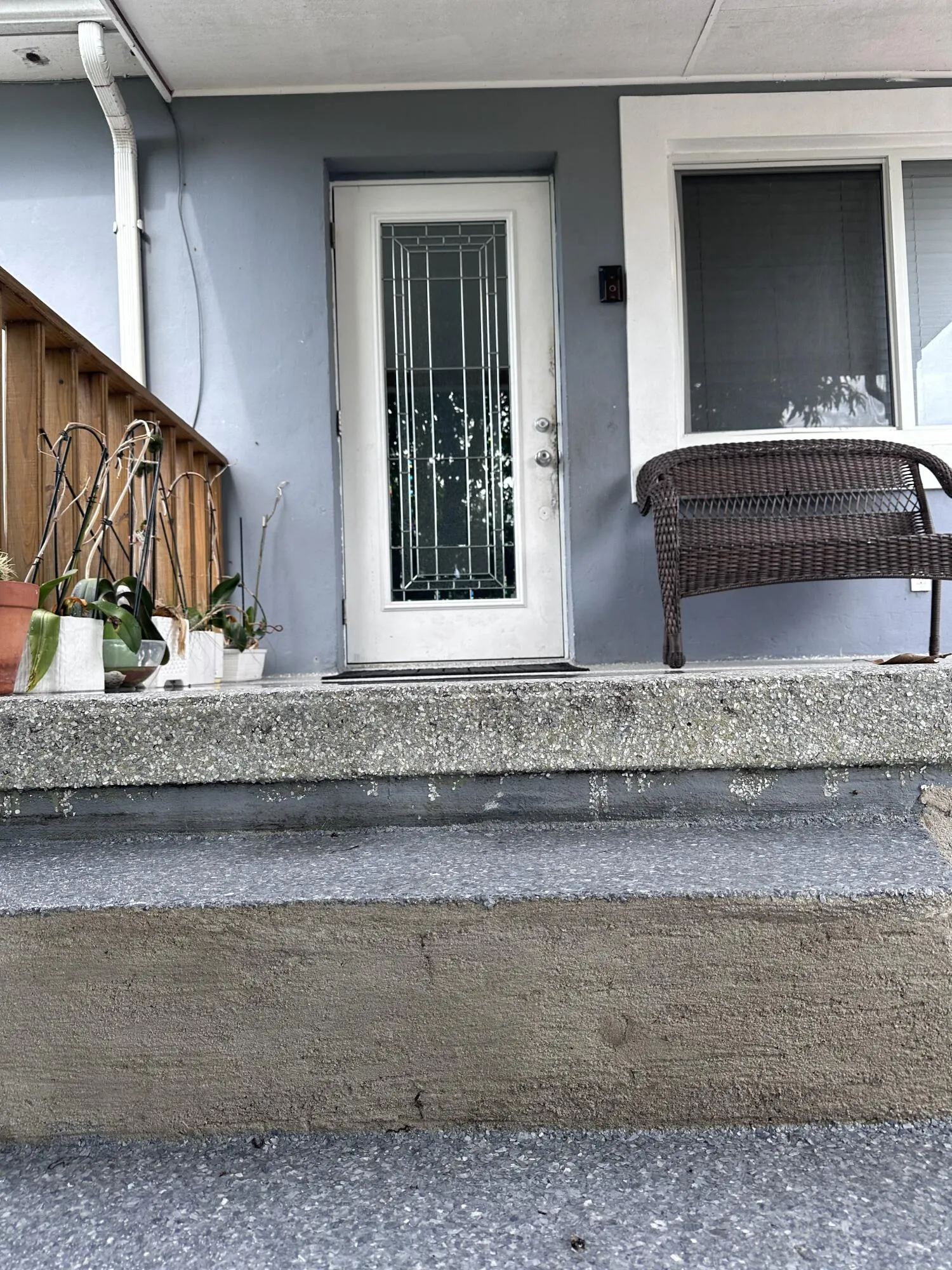 Cover front porch includes new concrete textured surfacing.