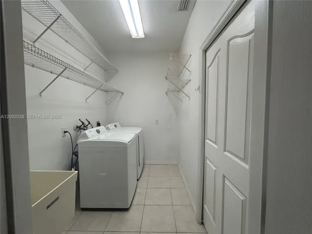 Laundry room with plenty of storage space!