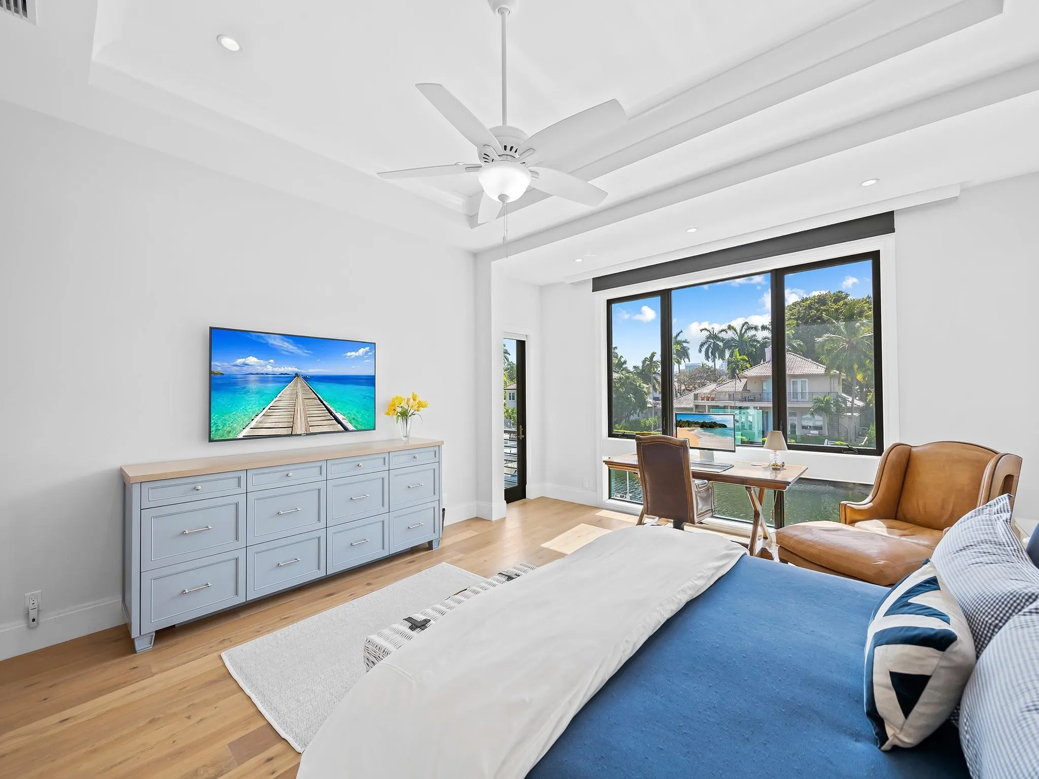 Ample natural lighting throughout the primary suite. Electric shades and blackouts