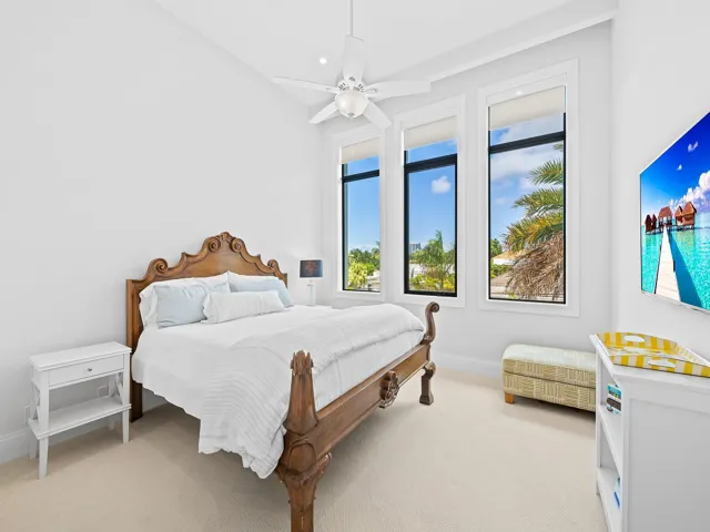 The guest suite is generously sized, filled with natural light, and includes a private en suite bathroom