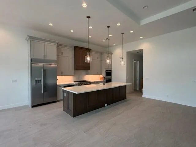 GOURMET KITCHEN WITH STACKED CABINETS, BUILT-IN FRIG, DOUBE OVEN AND MUCH MORE
