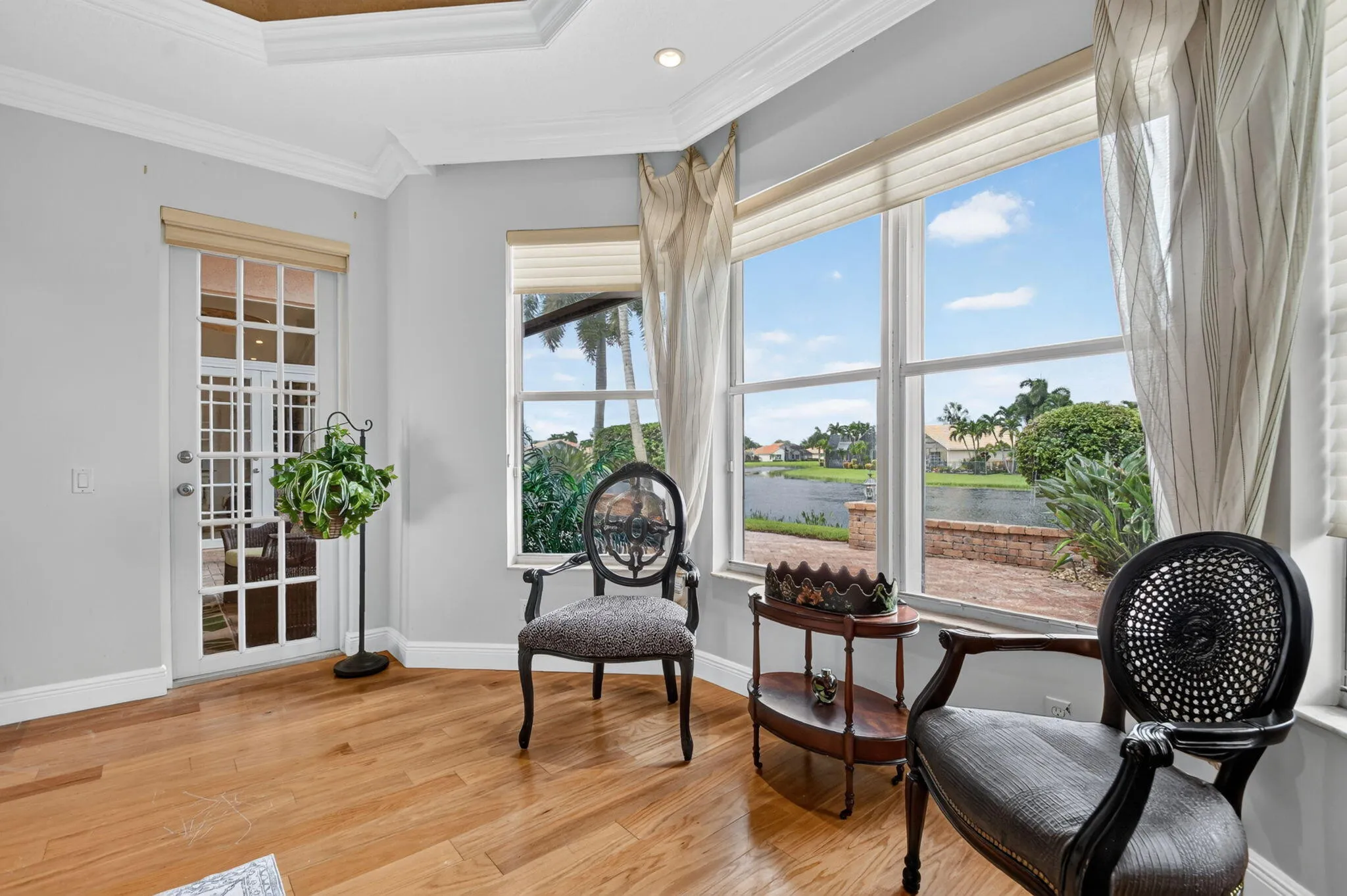 A charming bay window sitting area creates the perfect spot for morning coffee or evening relaxation.