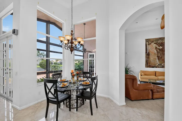 Two lovely tall windows overlooking the water, bringing beautiful views and light