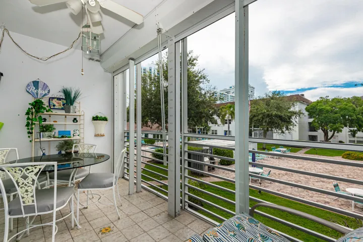Screened porch with electric roll down shutters!