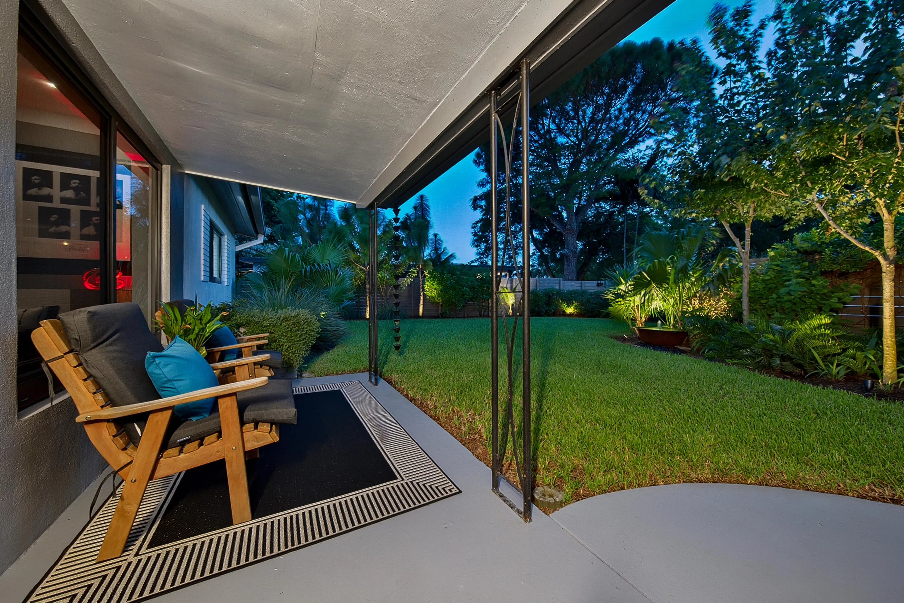 Enjoy the evening on your front porch overlooking the beautiful landscaping and lighting.