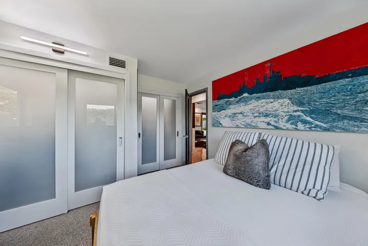 Frosted glass sliding doors covering the fully built out closet.