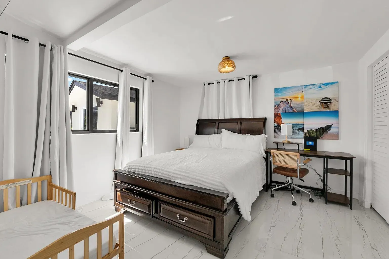White tile flooring, black-framed window, built-in louvered closet door, dark wood bed frame with integrated storage, and a woven pendant light fixture