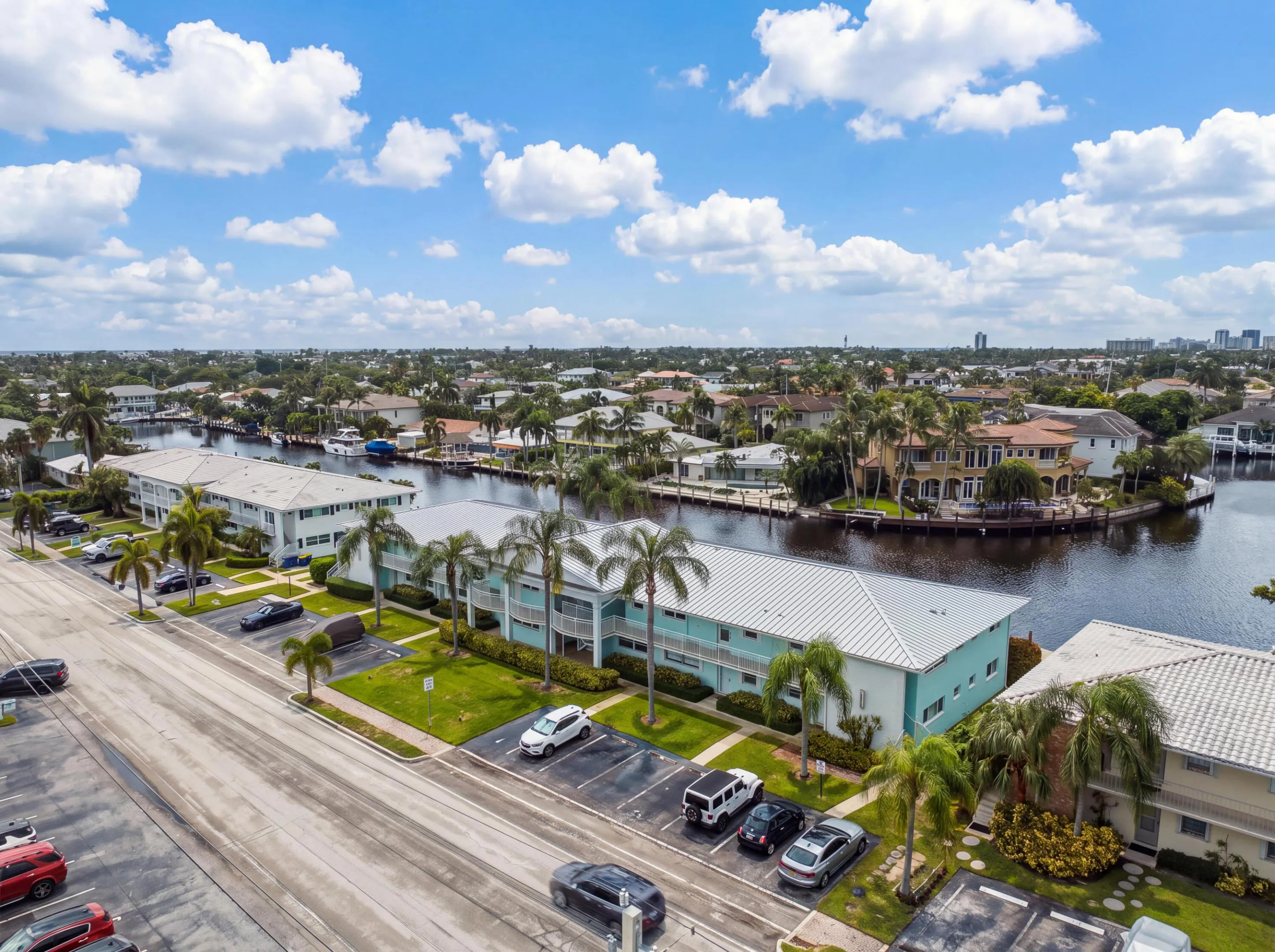 Waterfront community with multi-level residences, canal access, and mature landscaping