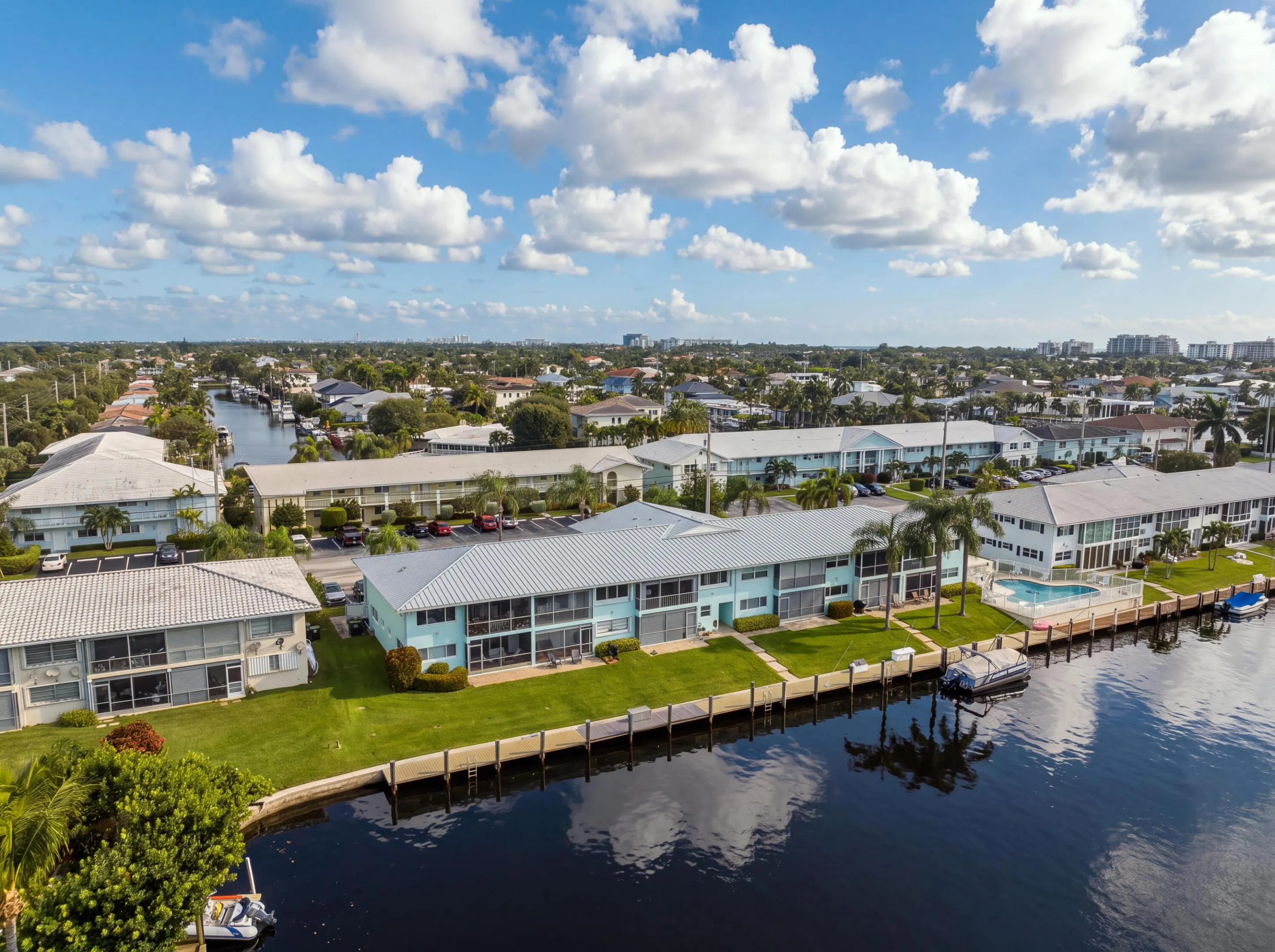 Waterfront properties featuring private boat docks and a communal swimming pool