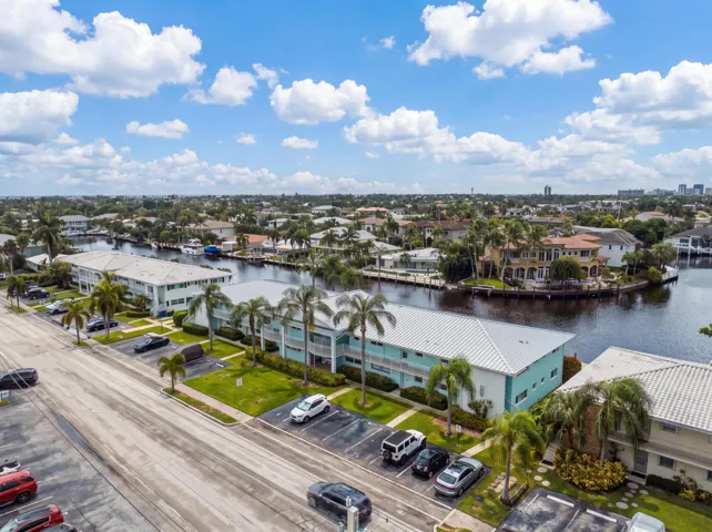 Waterfront community with multi-level residences, canal access, and mature landscaping