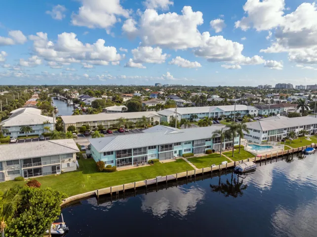 Waterfront properties featuring private boat docks and a communal swimming pool