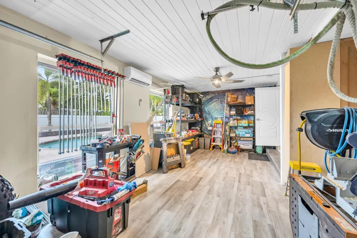 Garage with new garage door and air conditioner