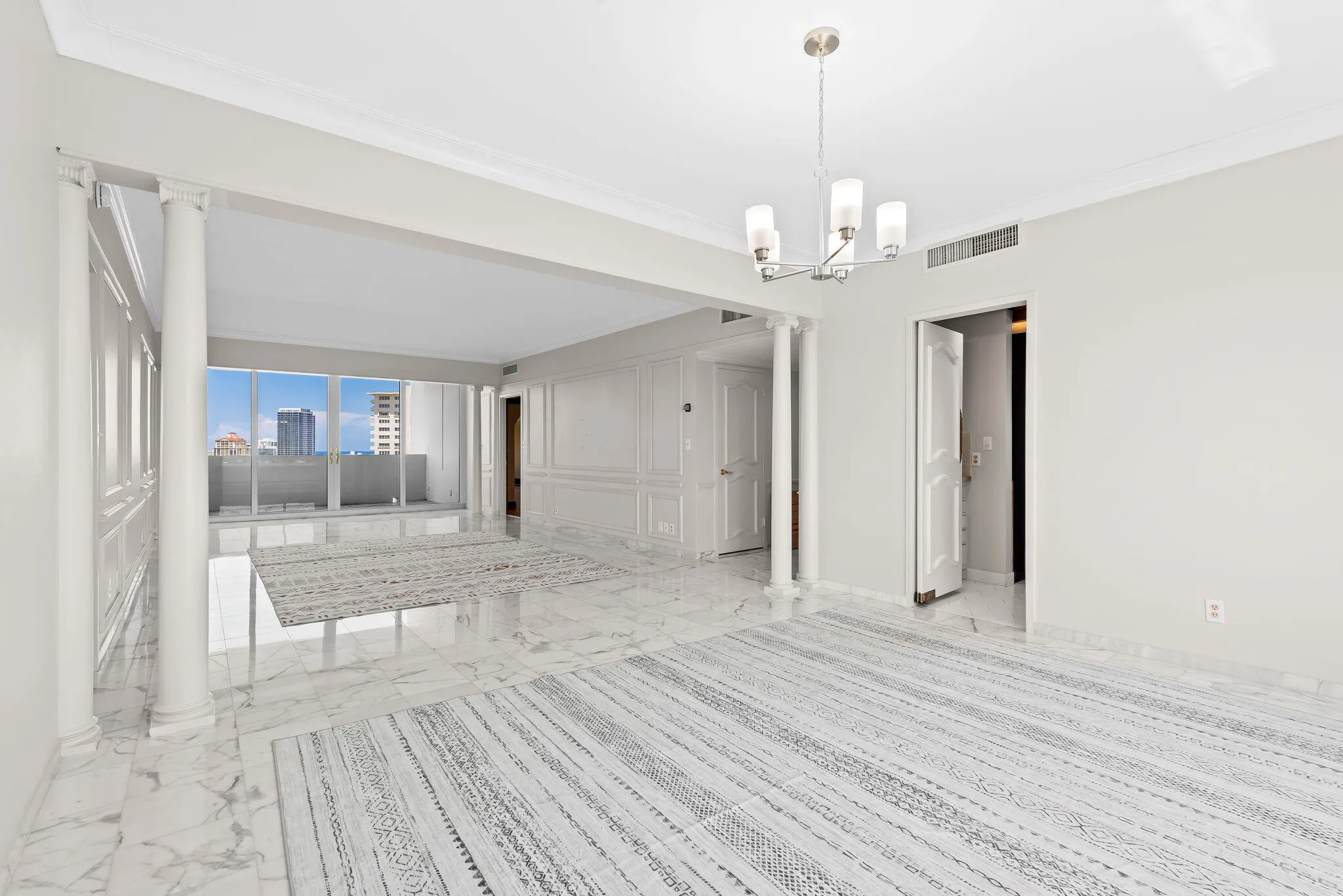 View from dining room to living room and open balcony