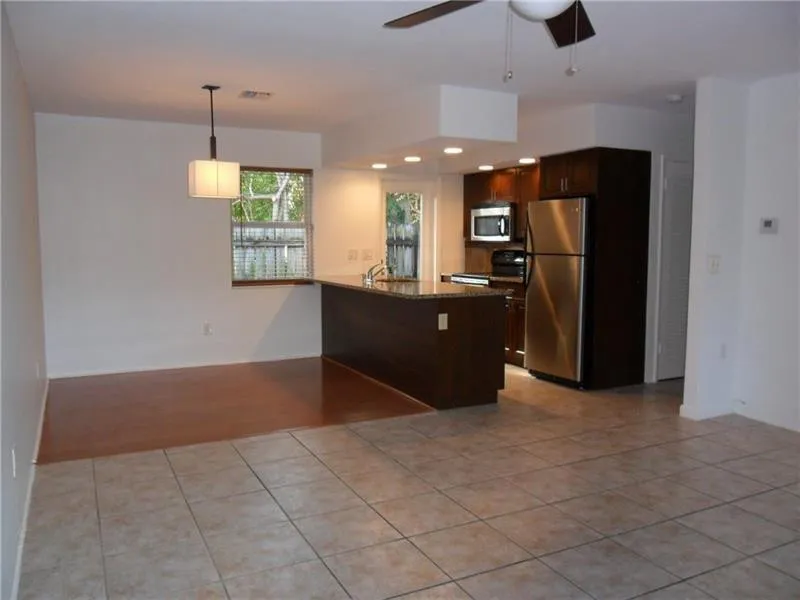 Kitchen with open dining and living area