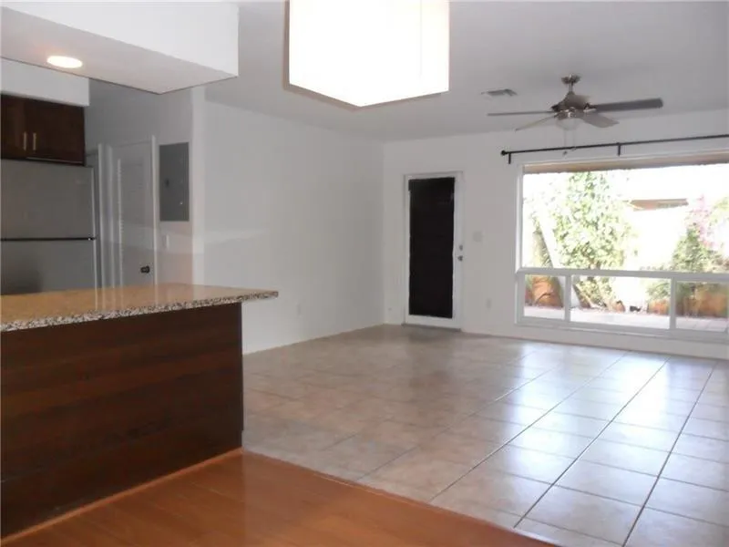 Living area with view to garden and wrap around patio.