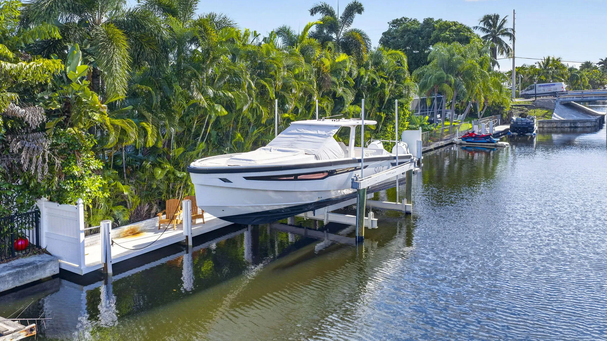 Private boat surrounded by mature tropical landscaping