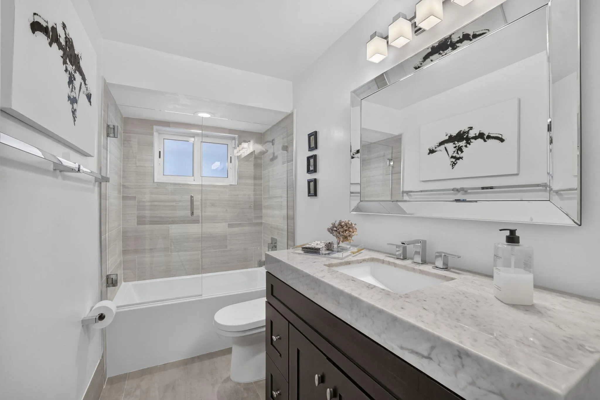 Floating vanity with stone countertop and integrated sink