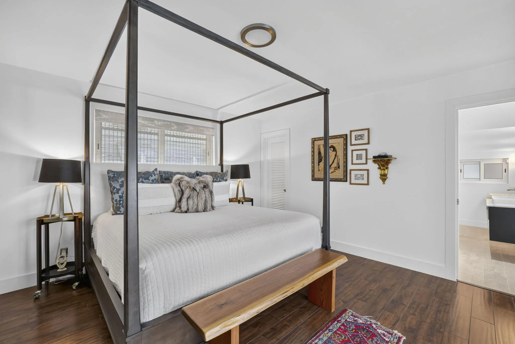 Wood-finish flooring with white walls and trim