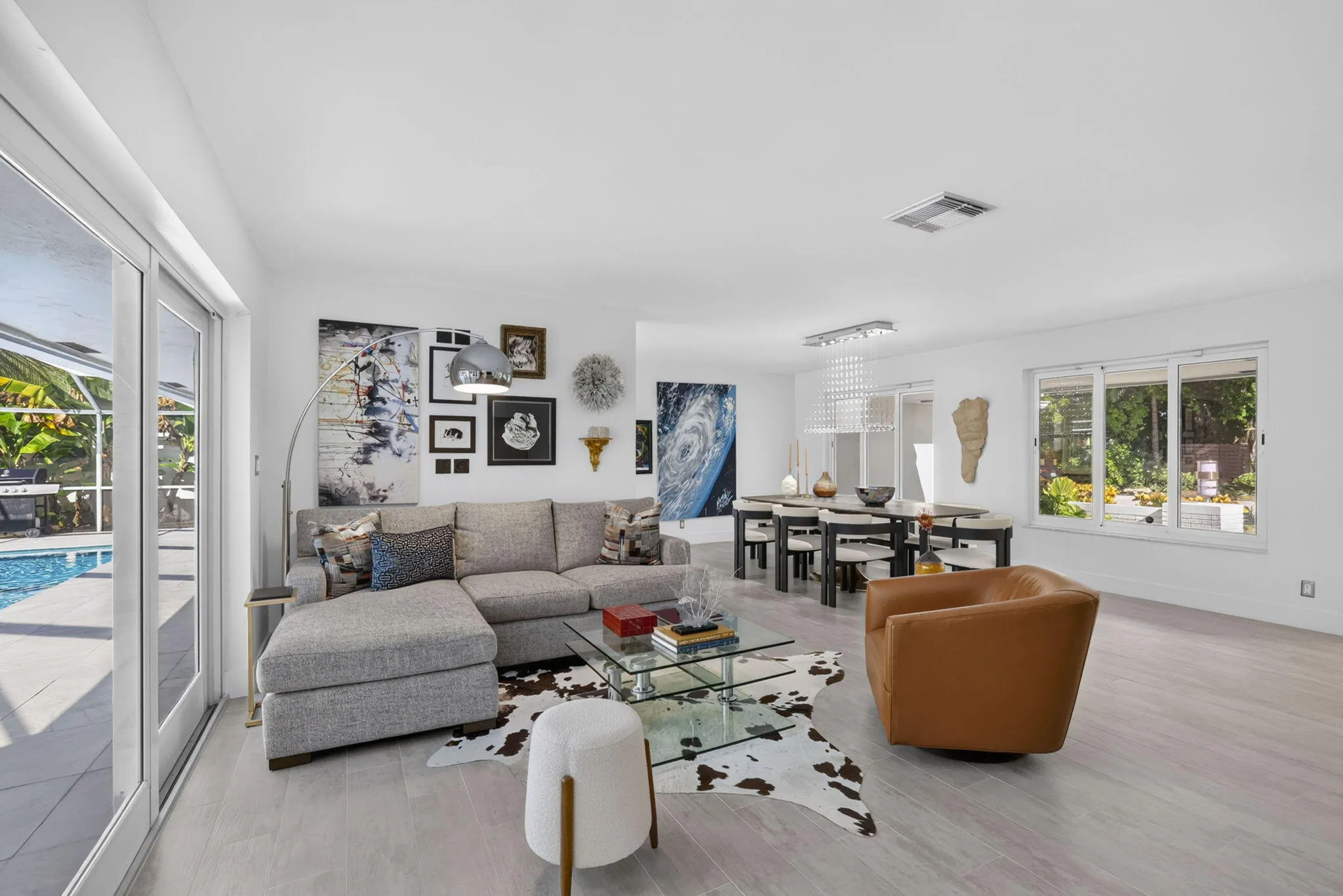 Recessed lighting, tile floors, and expansive sliding glass doors