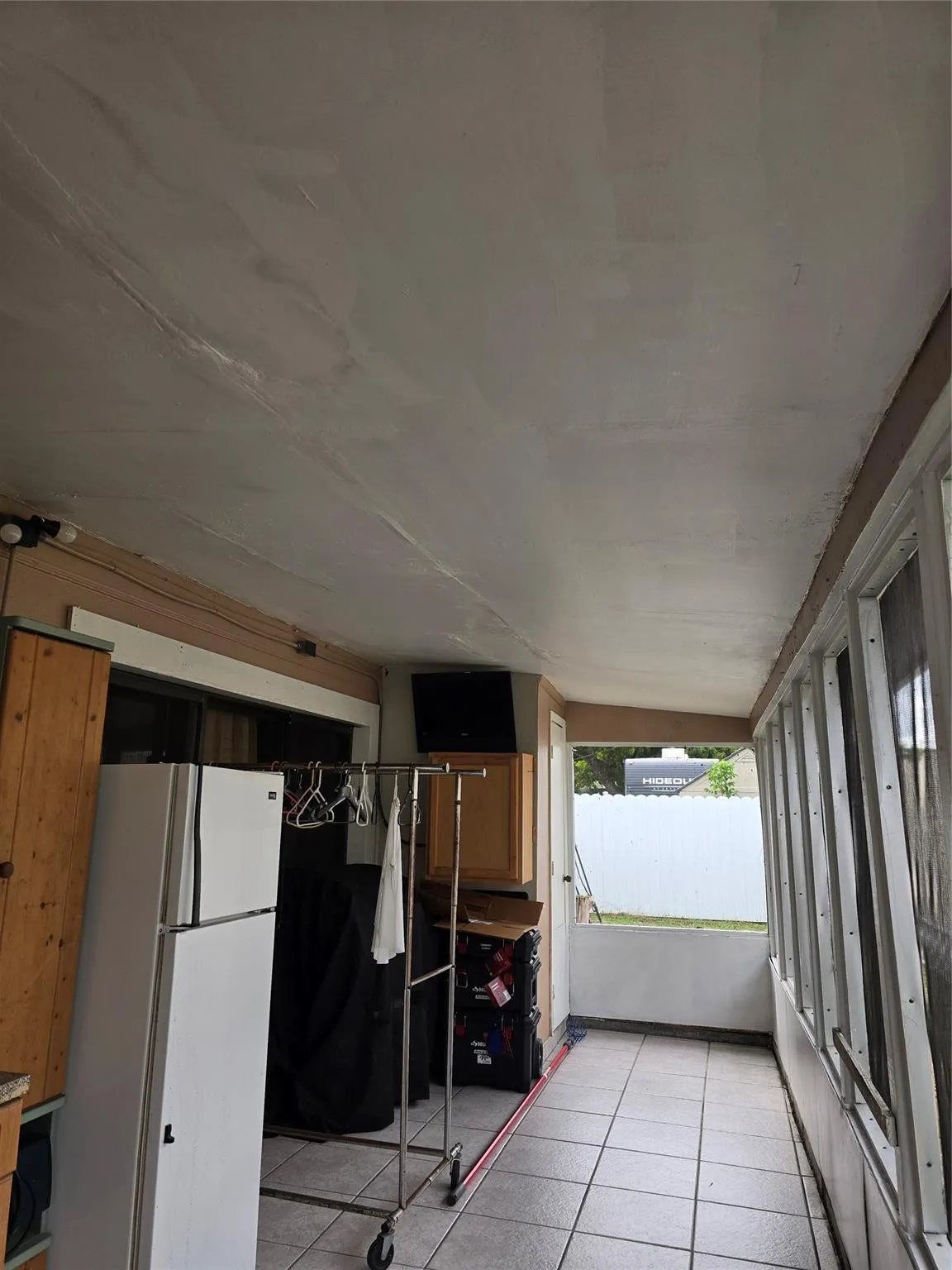 SCREENED AND ROOFED PORCH
