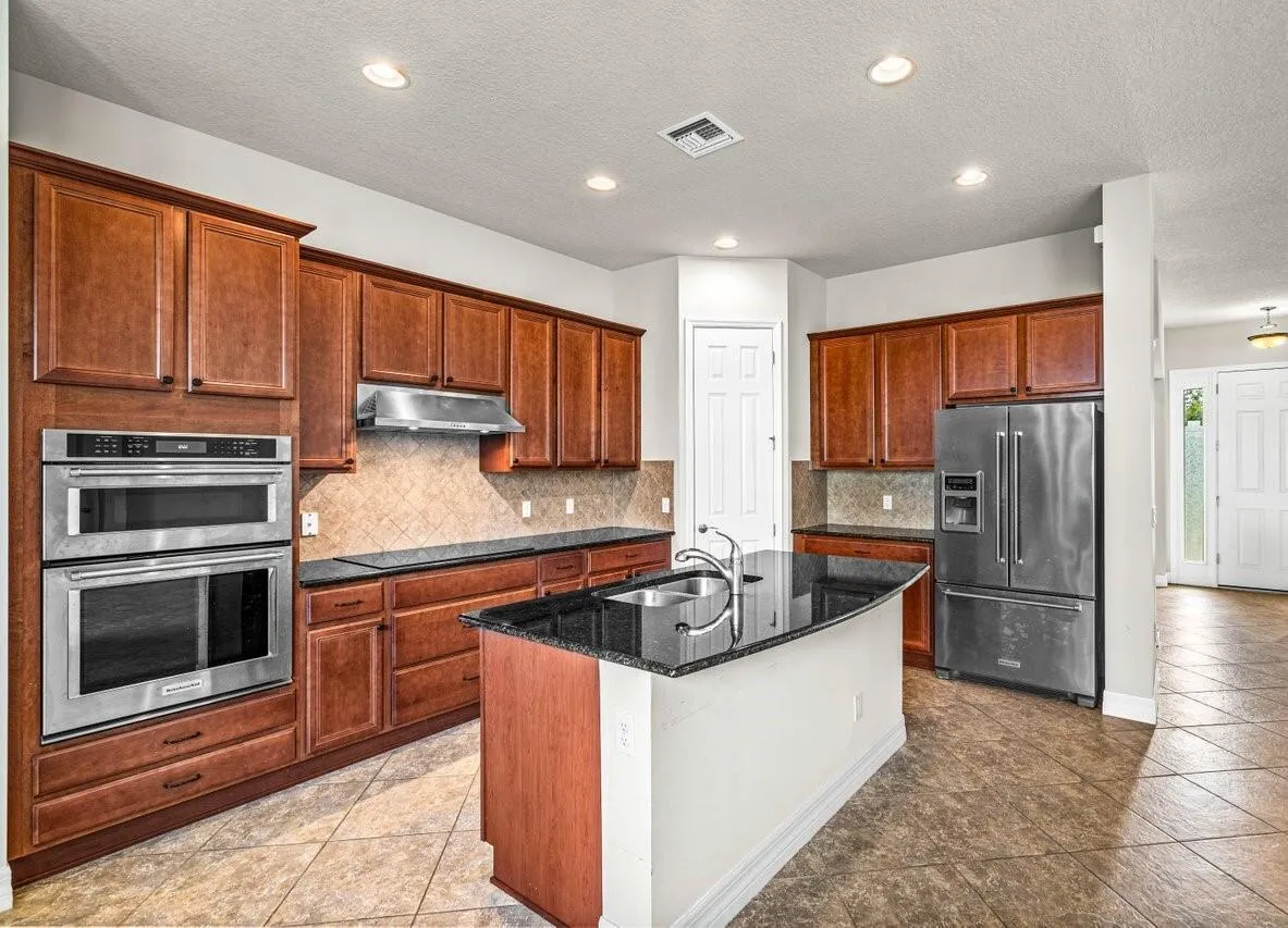 Fully equipped kitchen with stainless-steel appliances.