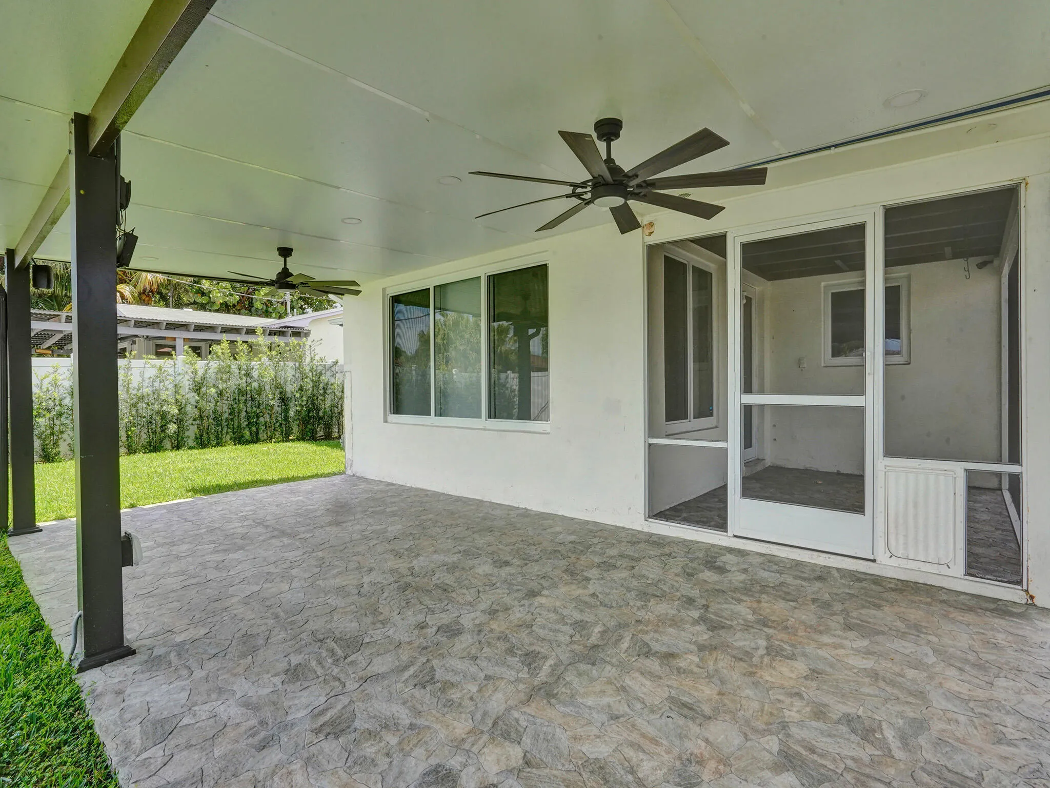 Huge rear patio expands the entire back of the house