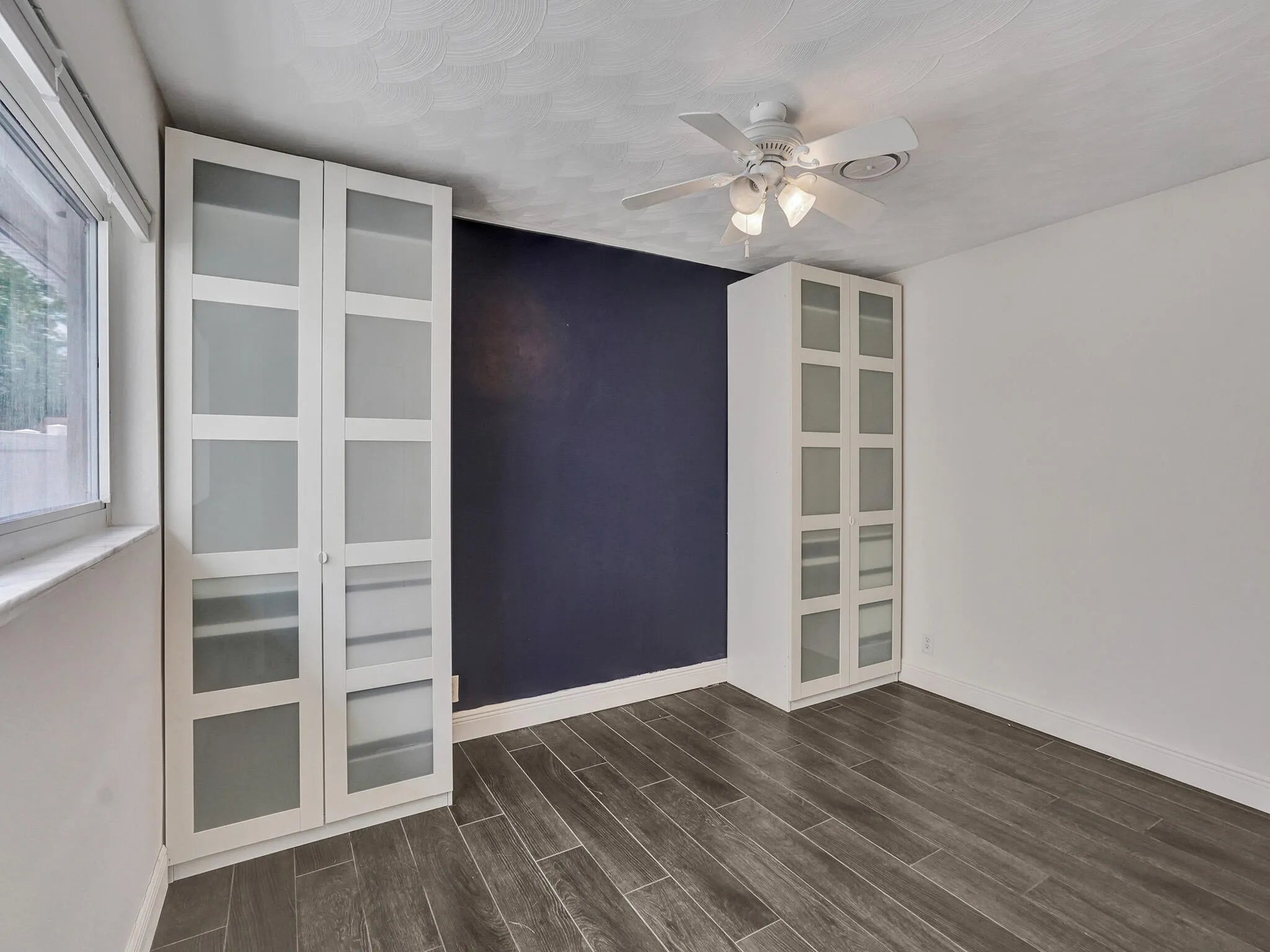 2nd bedroom with build in closet and shelves