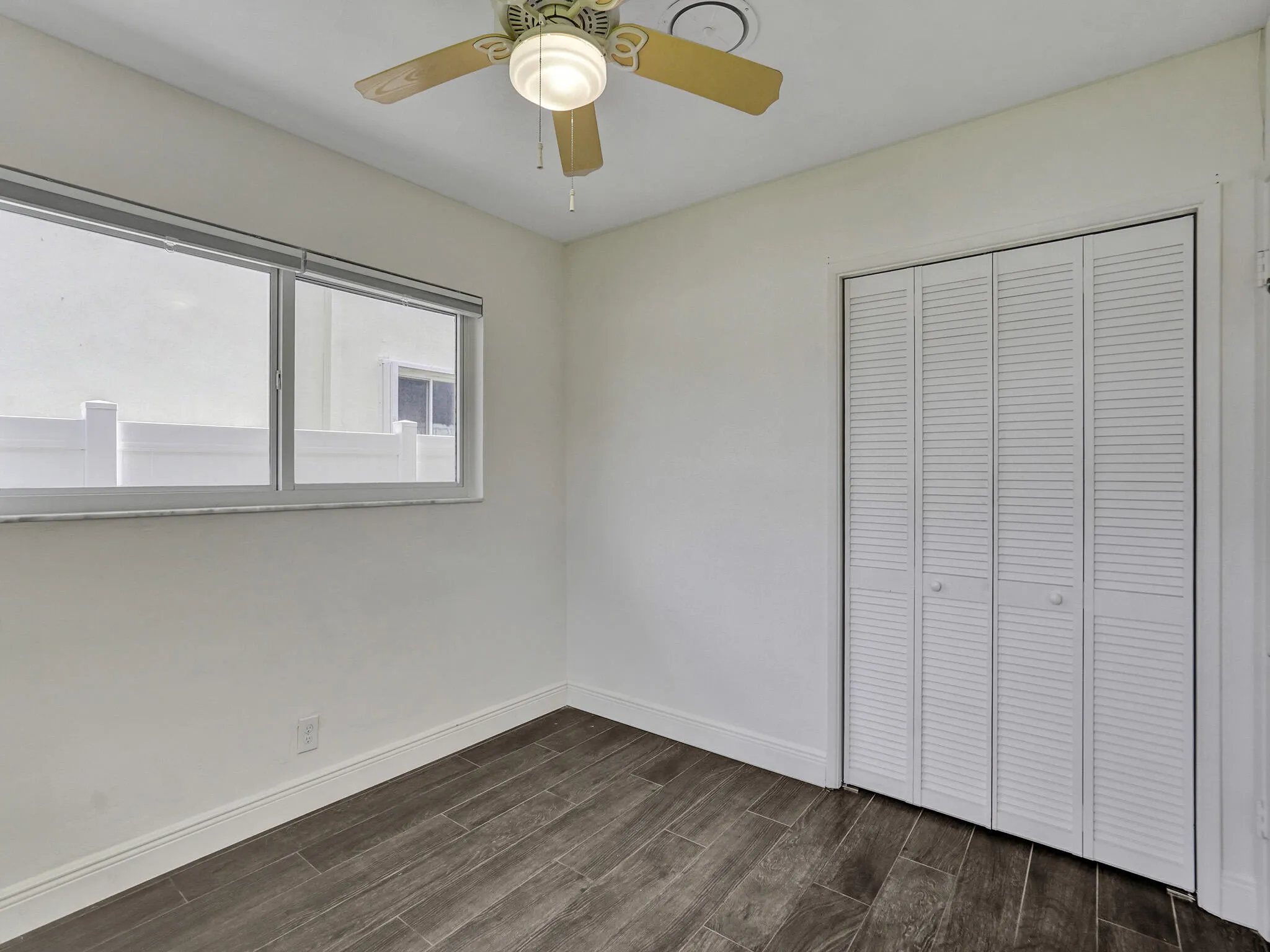 Perfect Guest room or Den/Office space with plenty of easily accessible storage cabinets.
