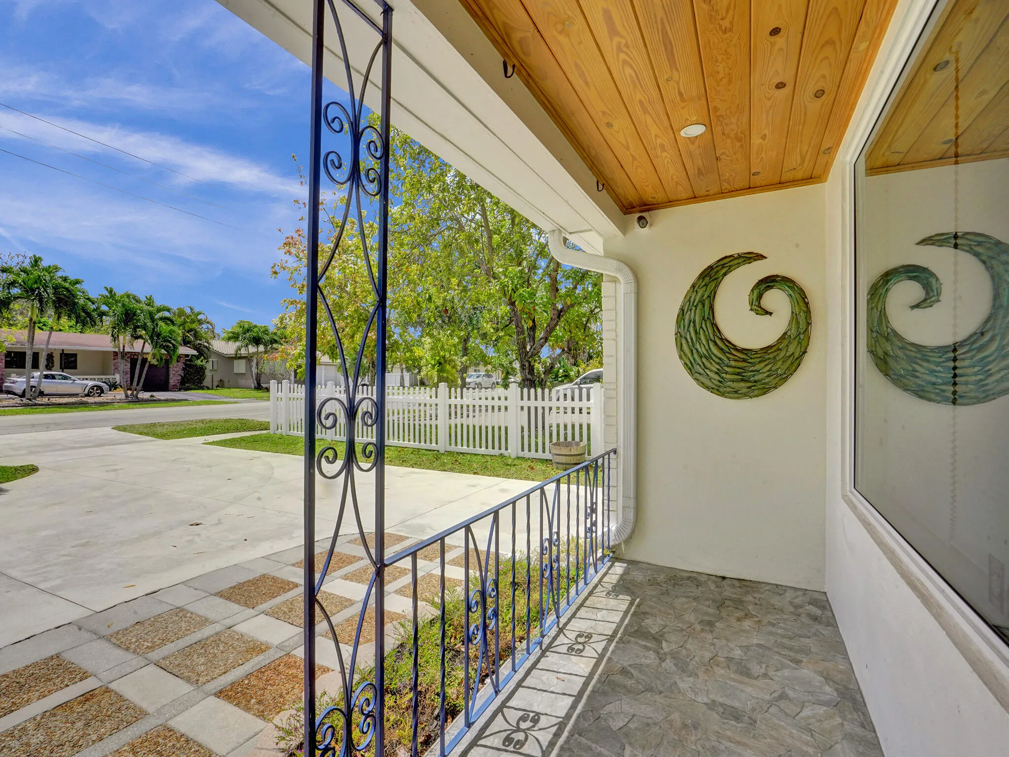 Covered front entryway is large and perfect for greeting guests even when it rains.