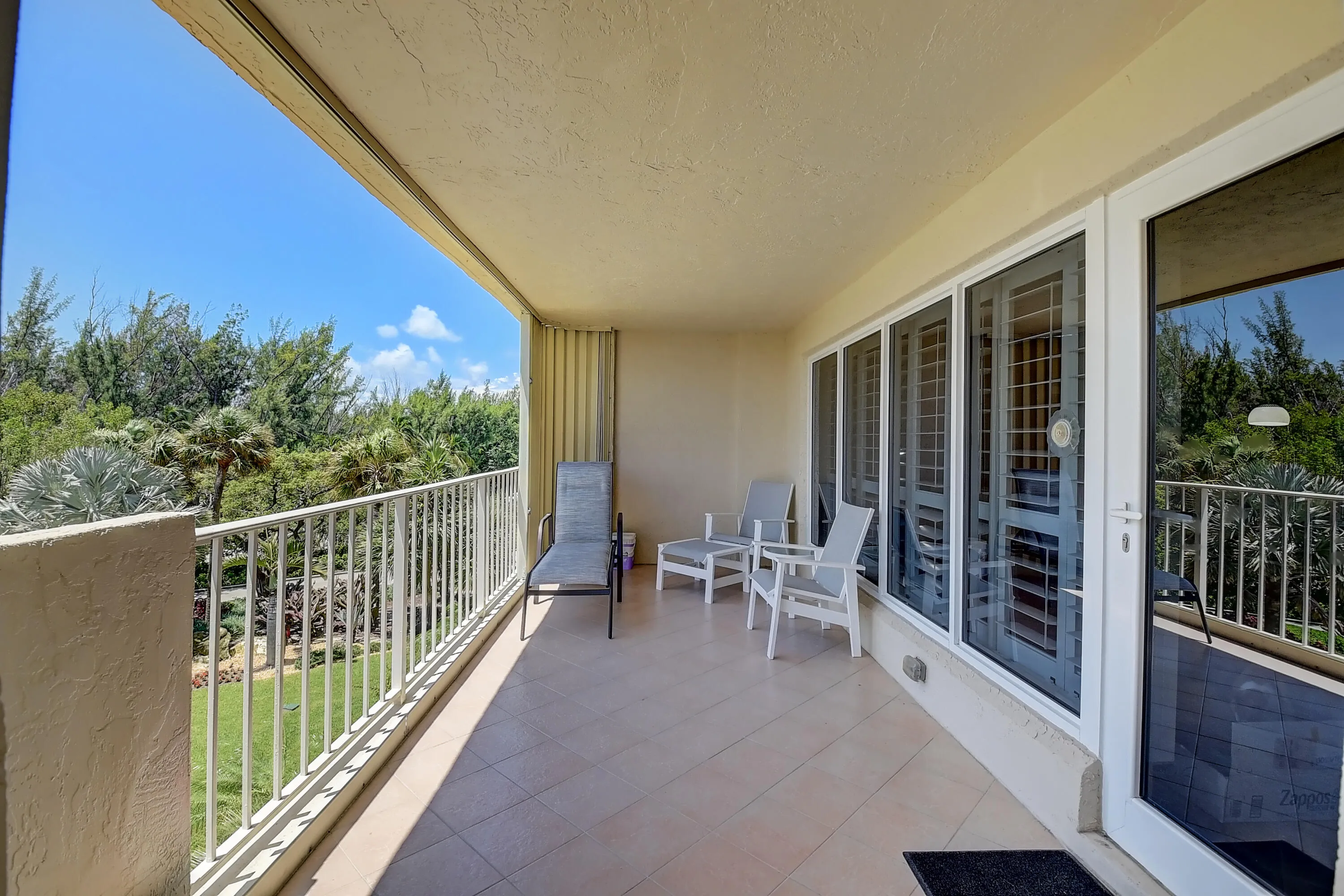 NEW EAST BALCONY WILL NO LONGER HAVE A CEMENT WALL (JUST NEW WHITE RAILINGS) NO SHUTTERS & BE PAINTED WHITE (BUILDING EXTERIOR ESTIMATED COMPLETION LATE FEB