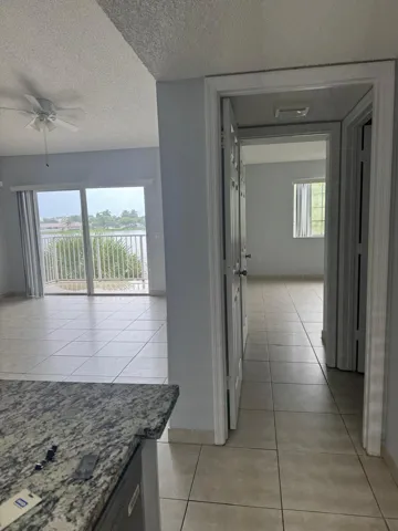 view from kitchen to balcony and bedroom