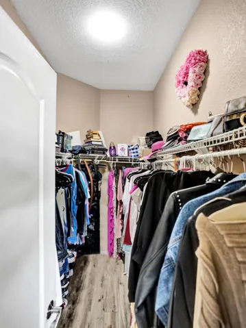Primary Bedroom Walk-In Closet – Spacious and well-organized with plenty of storage.