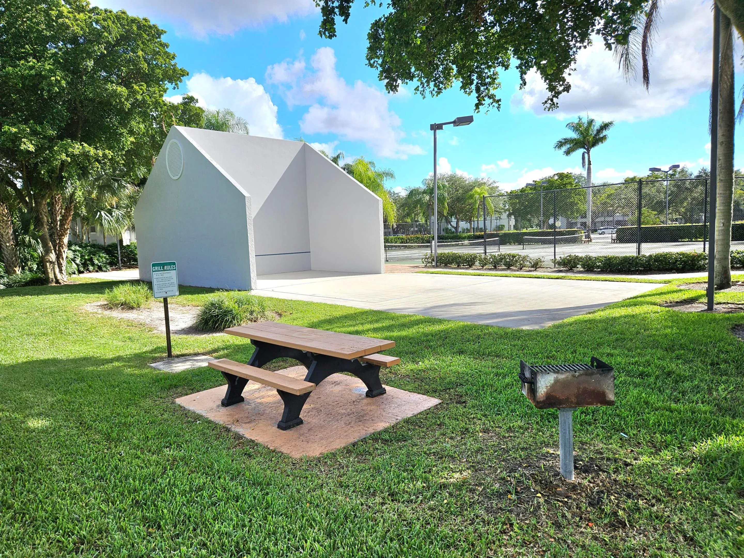 BUILT-IN PICNIC TABLES AND GRILLS ON THE GROUNDS