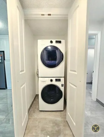 STACKABLE WASHER & DRYER, PERFECTLY HOUSED IN LAUNDRY CLOSET