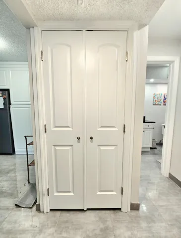 LAUNDRY CLOSET WITH FRENCH DOORS, HOUSING YOUR WASHER & DRYER