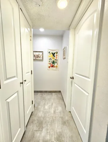 HALLWAY LEADING TO YOUR BEDROOM, LAUNDRY CLOSET & BATHROOM