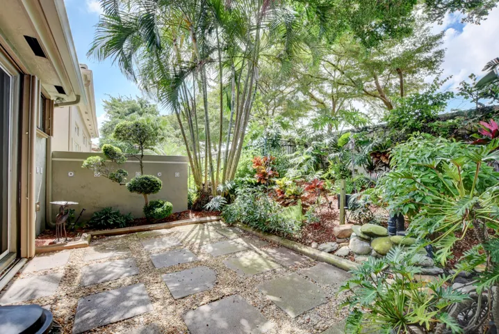 Seating area by waterfall and pond