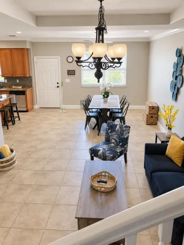 Open-concept view connecting the living, dining, and kitchen areas.