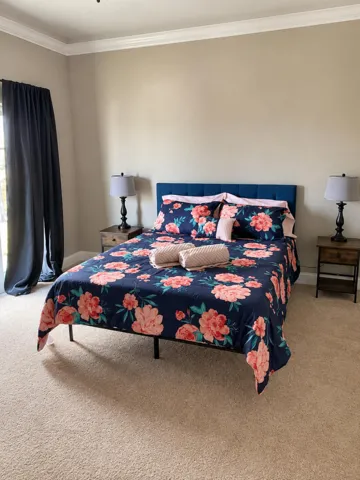 Furnished bedroom with natural light.
