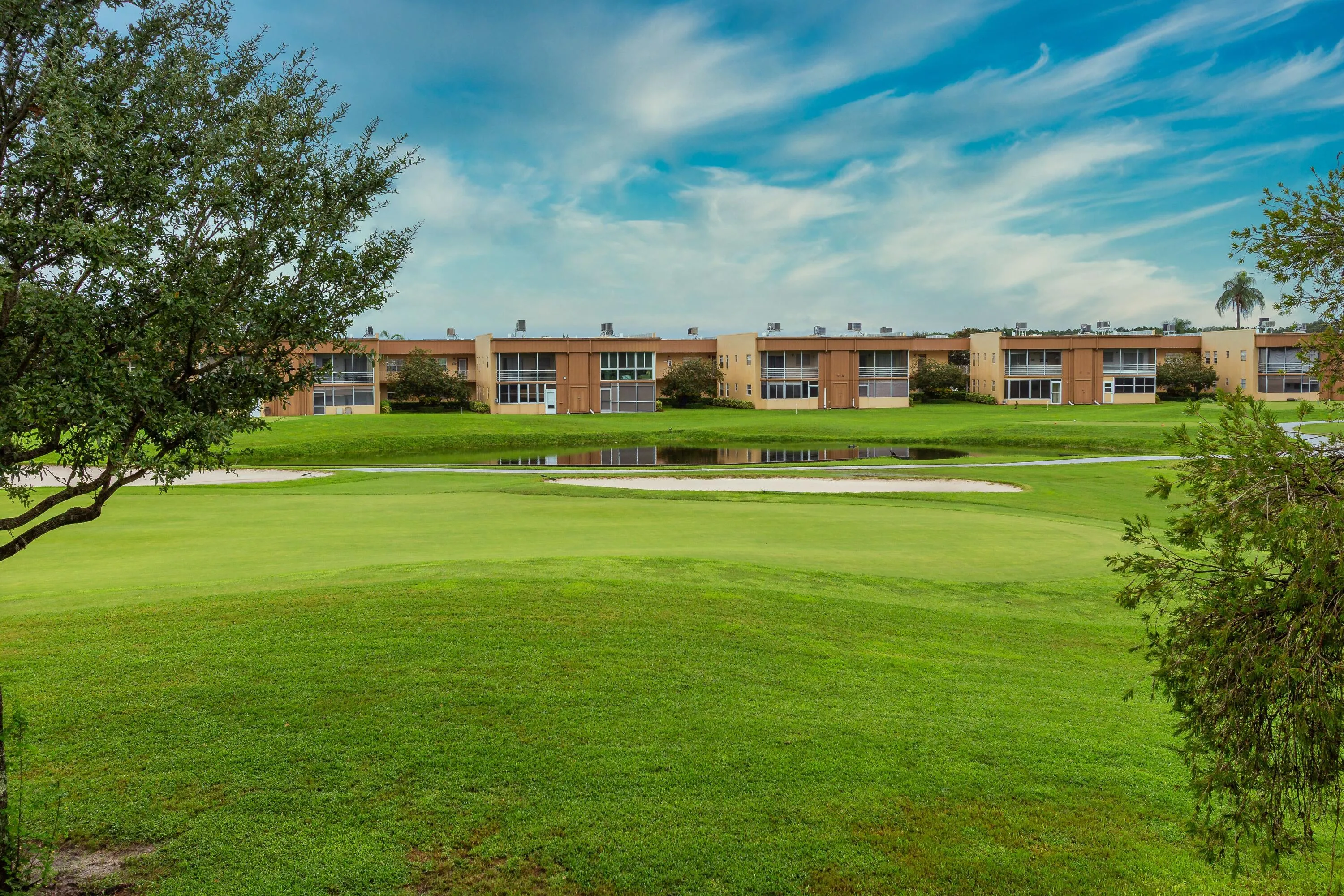 Watch the golfers from your private lanai