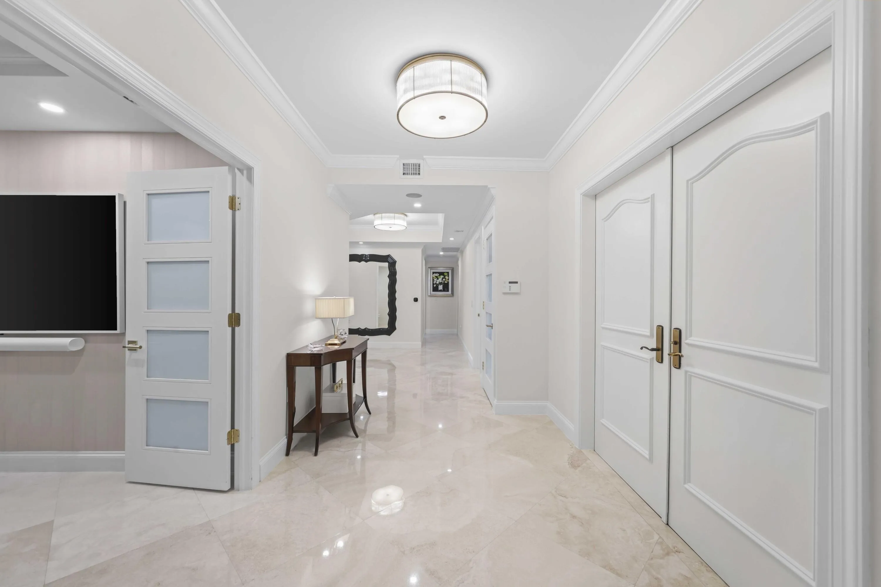 Foyer with entrance to home office on left and formal entry from corridor on right