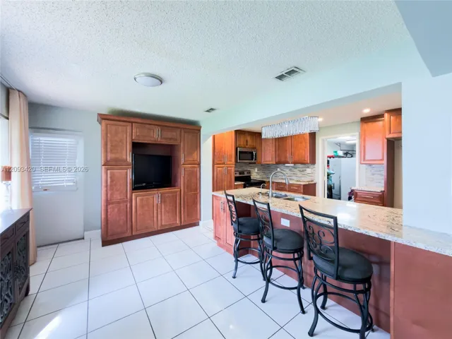 Open kitchen with large breakfast bar