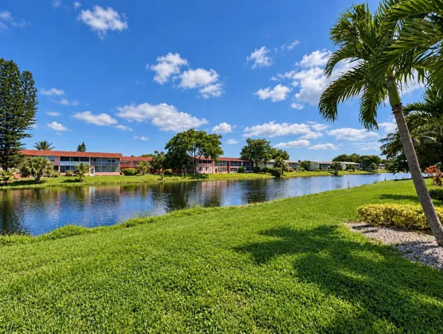 Gorgeous WATER VIEWS and Fabulous Location! First Floor CORNER 2/1.5 In The Prime Dorchester Section of 55+ Century Village