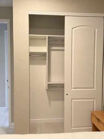Custom built in shelving in guest bedroom-other side of picture 19