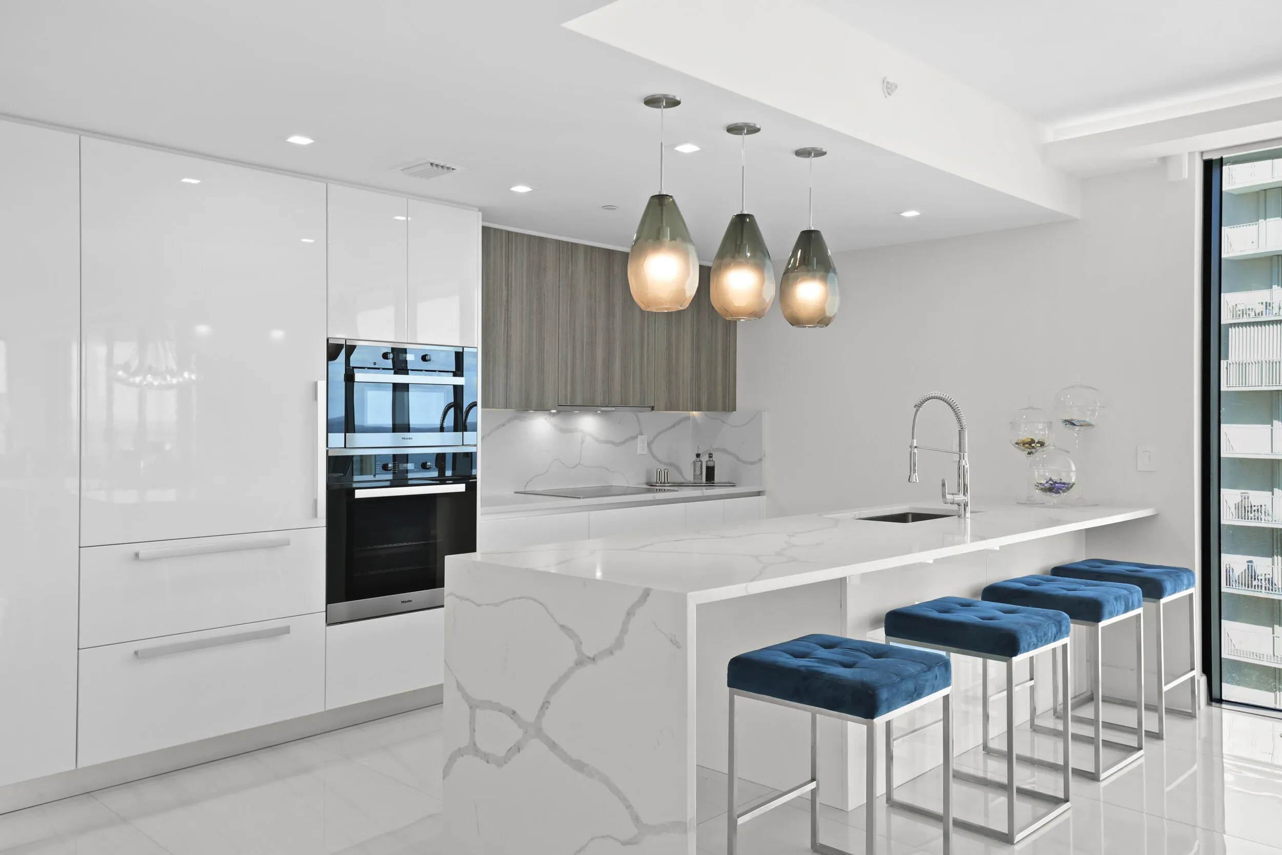 Culinary enthusiasts will enjoy a true chef's kitchen, highlighted with custom Italian cabinetry, Quartz countertops, and luxury (SubZero & Miele) appliances.
